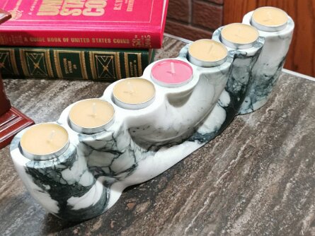 Marble Tealight Candle Holder – 7 Wells Natural Stone Home Decor Price: CAD 350.00 SKU: CDM-CHL-005 Seven flames. One stone. Carved from natural marble with dramatic veining, this...